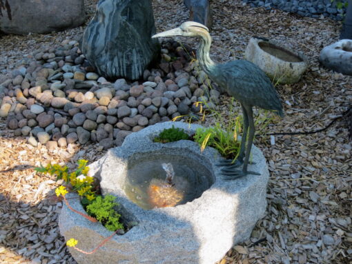 Brunnen Wasserspiel mit Reiher